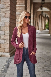 Close-up of wine red ribbed knit cardigan featuring symmetrical front square pockets