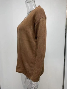 Close-up of brown V-neck knit sweater featuring ribbed cuffs and hem details