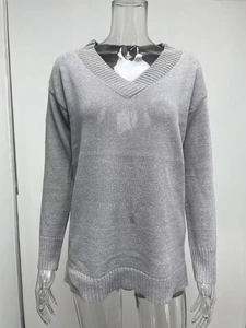 Close-up of the ribbed V-neck and fine knit texture on this gray long sleeve sweater