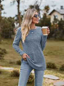 Women's crew neck long sleeve ribbed knit top in grey paired with denim jeans