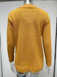 Rear view of ginger yellow V-neck knit sweater featuring ribbed hem and dropped shoulders