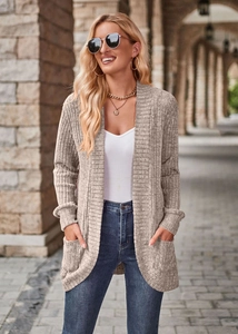Close-up of lightweight ribbed knit cardigan with functional dual side pockets in beige
