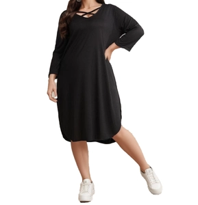 Detail of plus size black long sleeve dress with criss-cross V-neckline design