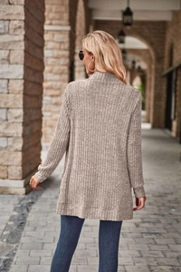 Rear view of a beige long-sleeved ribbed knit cardigan featuring vertical stripe texture