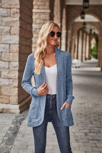 Close-up of fog blue knit cardigan featuring vertical rib texture and side patch pockets