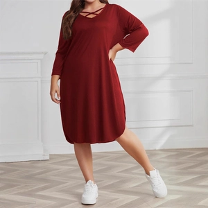 Plus size dark red mid-length dress with cross-neckline and stylish three-quarter sleeves