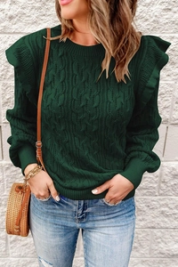 Detailed cable knit texture and ruffle shoulder design on a green round-neck sweater
