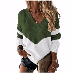 Detail of color-block knit sweater with deep V-neck and ribbed cuffs on model