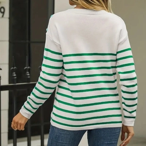 Rear view of striped knit sweater showing green stripes and white long sleeve design