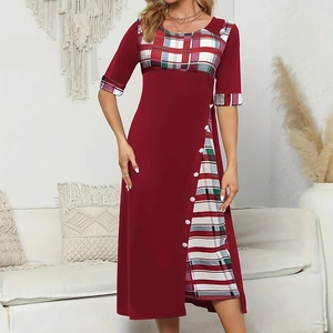 Detail of burgundy midi dress with plaid contrast stitching and decorative white buttons
