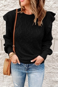 Detail of black cable-knit sweater with ruffle shoulder design and ribbed cuffs