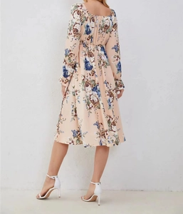 Rear view of floral long sleeve midi dress featuring elastic waist and vintage rose pattern
