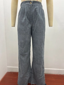 Detail view of high-waisted corduroy pants with front pleats and button closure