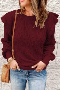 Detail of burgundy cable-knit sweater with ruffle shoulders and ribbed sleeve cuffs