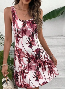 Close-up of tropical palm tree 3D print and sleeveless cut on bohemian dress