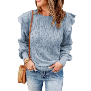 Light blue knit sweater with ruffle shoulders and cable knit details in a loose fit