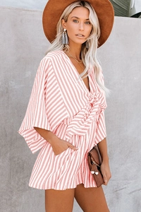 Detail of pink striped summer romper with flare sleeves and drawstring waist tie
