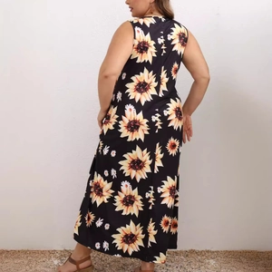 Women's plus size sleeveless maxi dress with vibrant sunflower print on black fabric