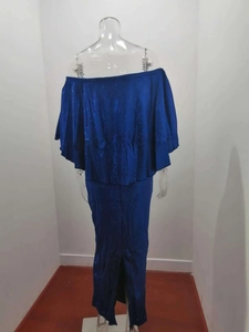 Detail of royal blue off-shoulder dress with ruffled back and shimmering fabric