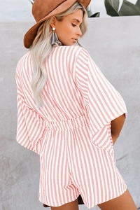 Detail of pink and white striped romper with flared sleeves and elastic waist design