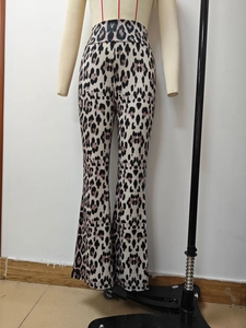 Close-up of high-waisted leopard print flare pants on a mannequin with slim fit style