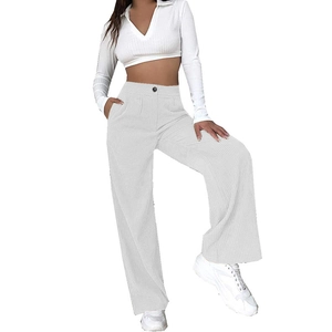 Close-up of high-waisted white corduroy wide-leg pants and ribbed V-neck long sleeve crop top