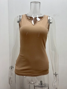 Detail of camel ribbed knit tank top showing unique V-neck notch and textured fabric