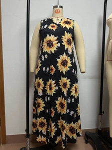 Close-up of sleeveless sunflower print maxi dress in plus size with round V-neckline