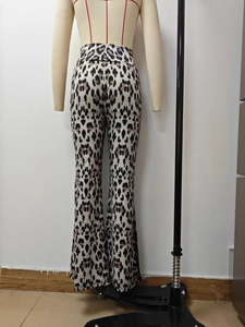 Rear view of high waisted leopard print flare pants showing slim fit and patterned fabric