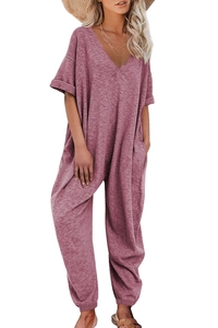 Detail of mauve V-neck short sleeve jumpsuit with side pockets and tapered cuffs