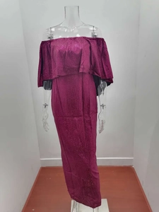 Close-up of the ruffled off-shoulder neckline on a burgundy glitter mermaid evening dress