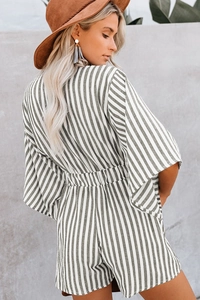 Detailed back view of striped summer romper with deep V-cut and elastic waist detail