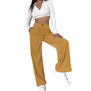 Detail of ginger yellow corduroy wide-leg pants with high waist and vertical ribbed texture