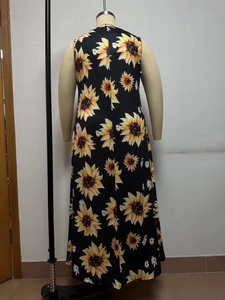 Detail view of the back of a sleeveless maxi dress with sunflower and daisy floral print