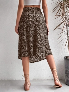 Back view of a floral print midi skirt with high slit and bohemian A-line silhouette