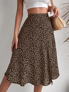 Floral A-line midi skirt with high waist design and brown side slit on a model