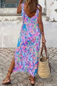 Detailed back view of a slim floral long dress with abstract prints and a high side slit