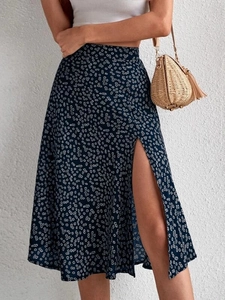 Detailed view of high waist side slit navy blue floral midi skirt with summer vacation style