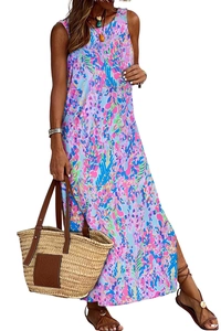 Detail of floral print maxi dress featuring a side slit and a colorful abstract pattern