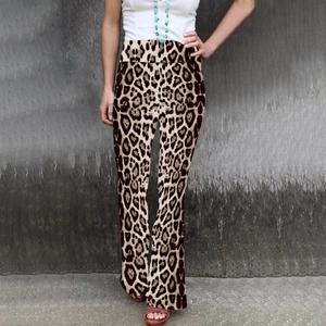 Detailed view of high waisted flare trousers featuring a classic leopard print pattern