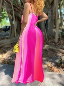 Detail of elegant pink gradient long dress featuring thin straps and low back design