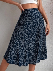 Detailed view of floral pattern and lightweight fabric texture on high waist midi skirt