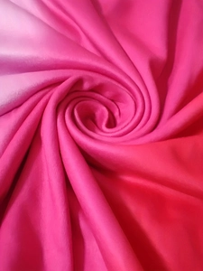 Detail of high-quality pink gradient satin fabric with smooth texture and luxury silk luster