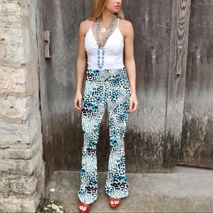 Detail of high-waisted flared leggings featuring blue and black leopard animal print pattern