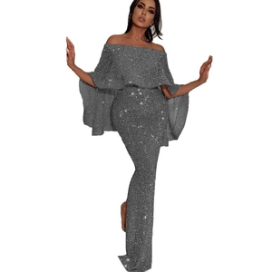 Close-up of sparkling sequin fabric and elegant ruffled off-shoulder evening dress