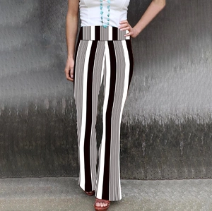 Detail view of high waisted flared pants featuring a classic black and white vertical stripe pattern
