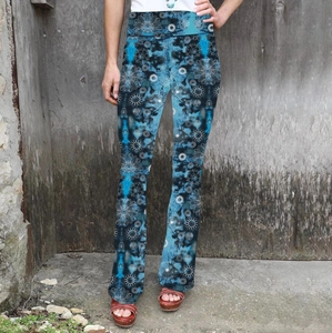 Detail of high waisted flared pants with white mandala print and tie-dye pattern