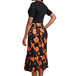 Robe longue noire élégante à taille haute avec imprimé floral orange et ourlet volanté