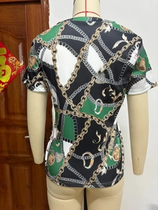 Detail view of T-shirt back with vintage gold chain prints and color-block design