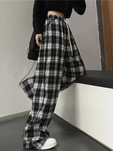 Pantalon large à carreaux noir et blanc à taille haute avec cordon de serrage